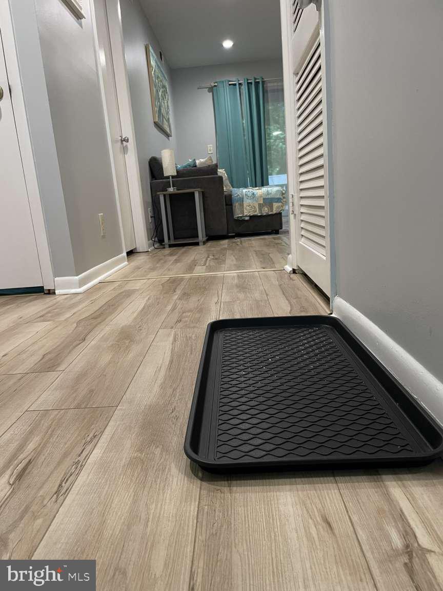 39633 Round Robin Way, Unit 2602 Bethany Beach, DE 19930 - Photo 6 of 43 a view of a hallway with wooden floor