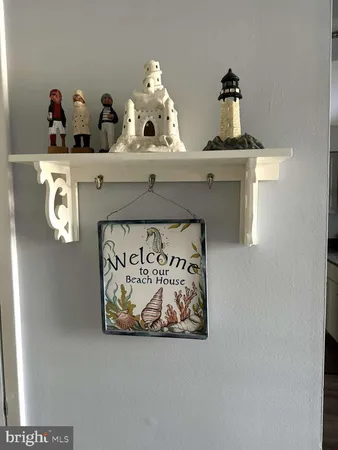 a shelf with painting on it and table