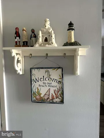 a shelf with painting on it and table