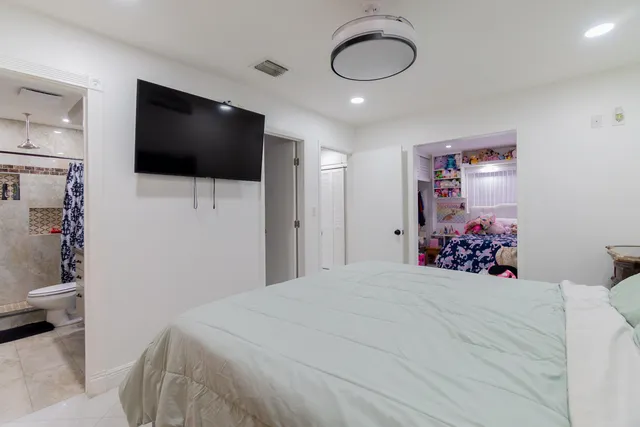 a view of walk in closet with clothes