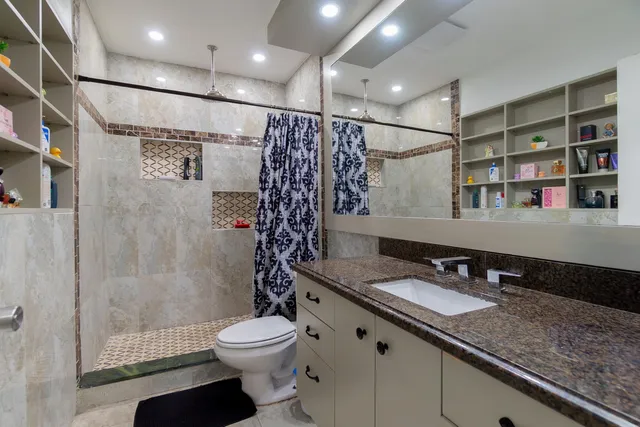 a bedroom with bed and a window