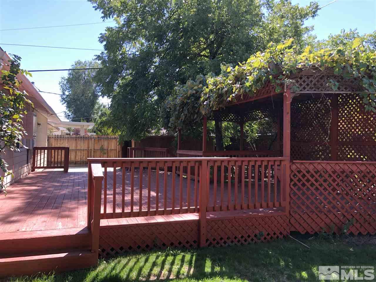 695 Ibis Lane Reno, NV 89503 - Photo 11 of 14 a view of a wooden deck with a bench