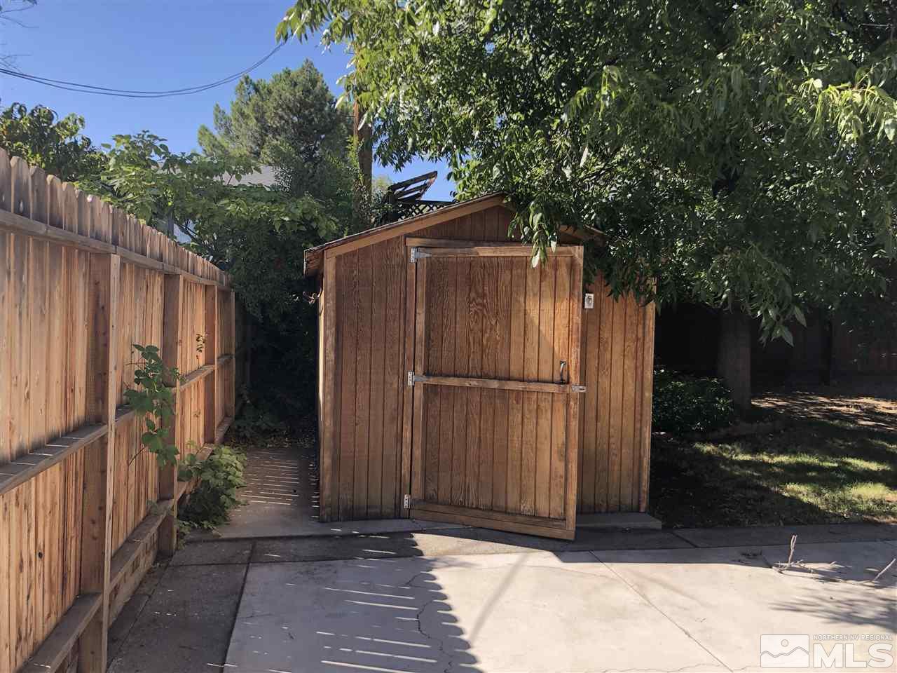 695 Ibis Lane Reno, NV 89503 - Photo 12 of 14 a wooden fence with trees in front of it