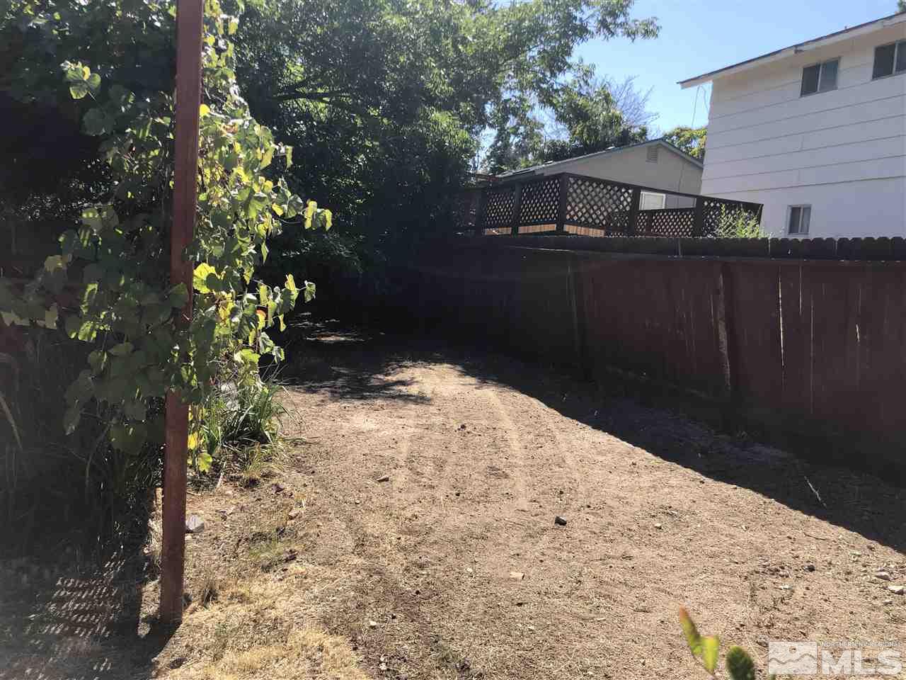 695 Ibis Lane Reno, NV 89503 - Photo 14 of 14 a backyard of a house with lots of green space