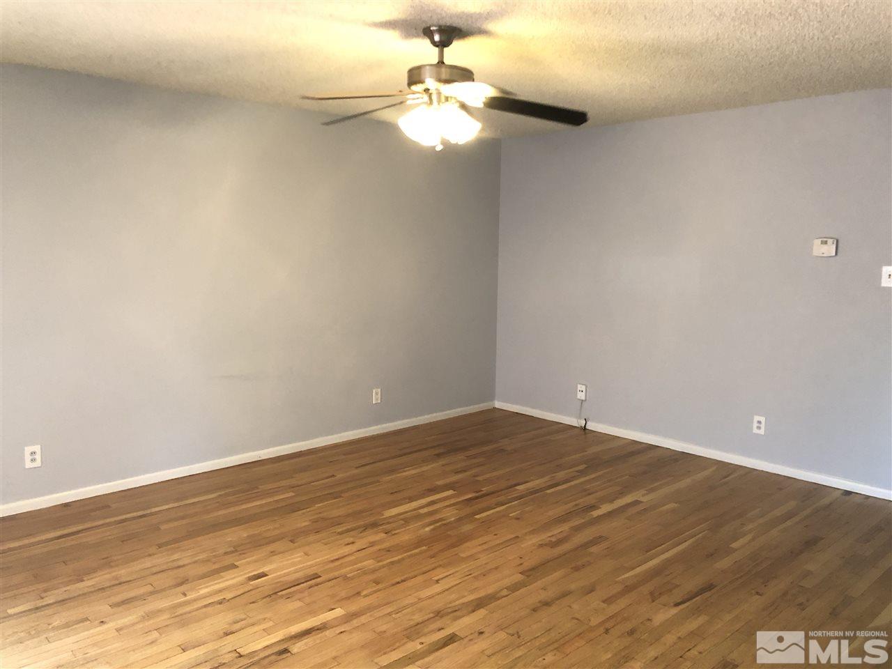 695 Ibis Lane Reno, NV 89503 - Photo 2 of 14 a view of an empty room and chandelier fan