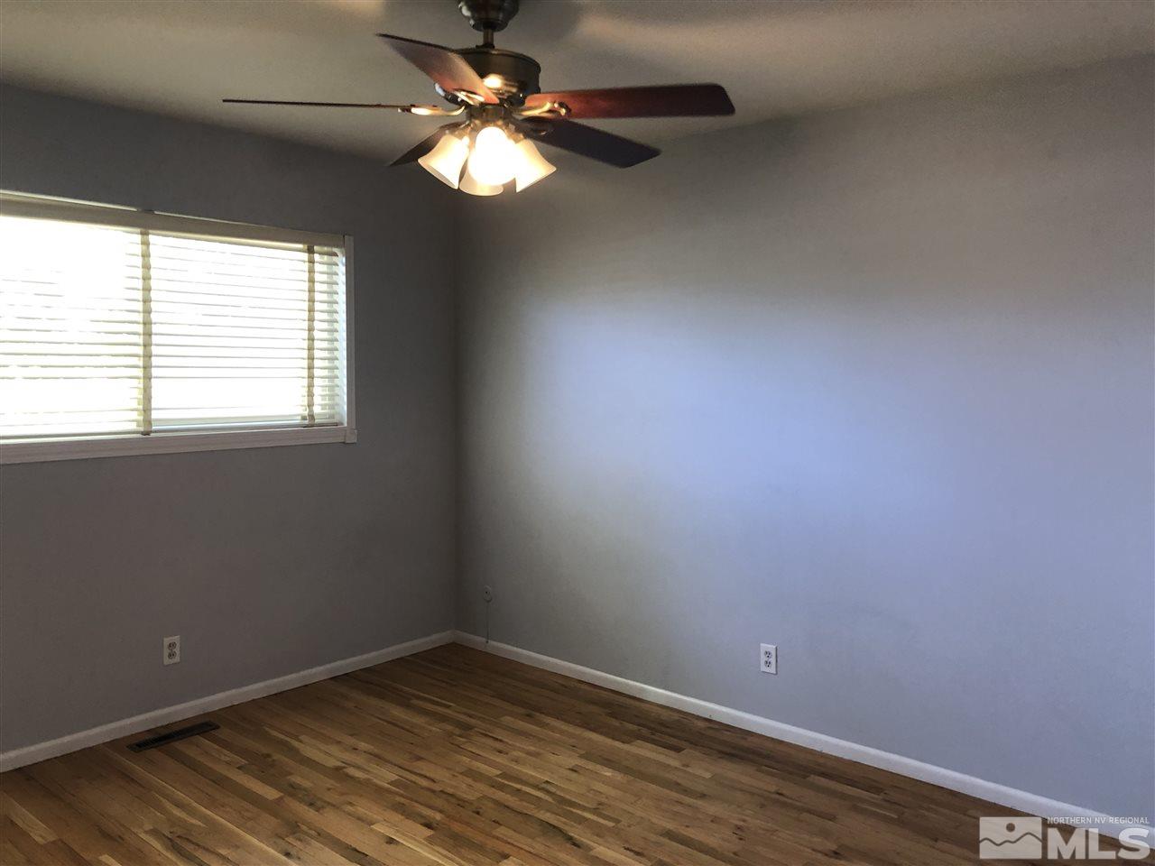 695 Ibis Lane Reno, NV 89503 - Photo 5 of 14 an empty room with a window