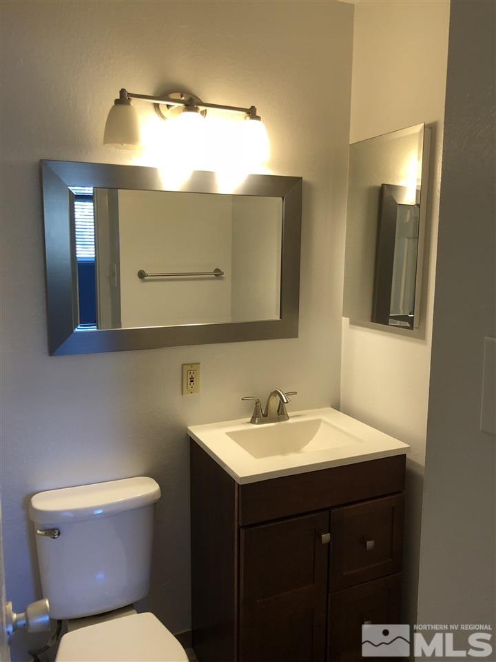 695 Ibis Lane Reno, NV 89503 - Photo 8 of 14 a bathroom with a sink and a mirror