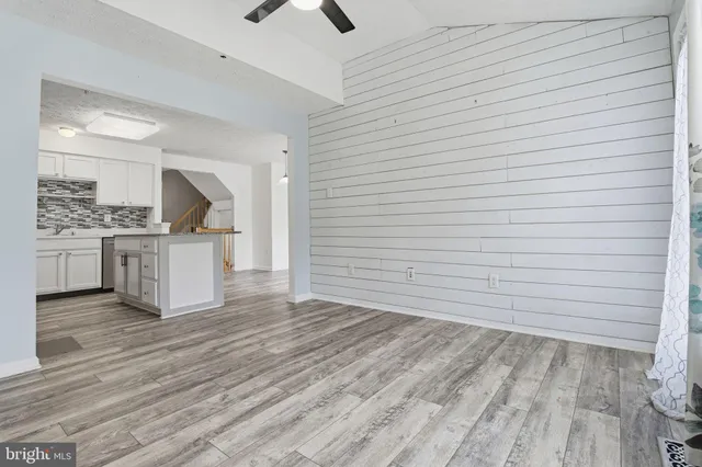 a view of a kitchen with a sink and cabinets