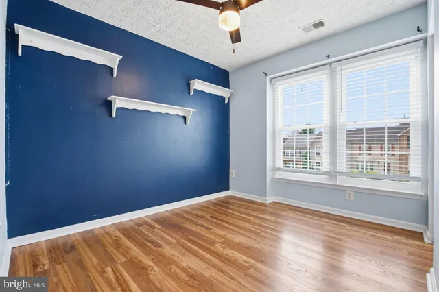 a view of a room with a large window