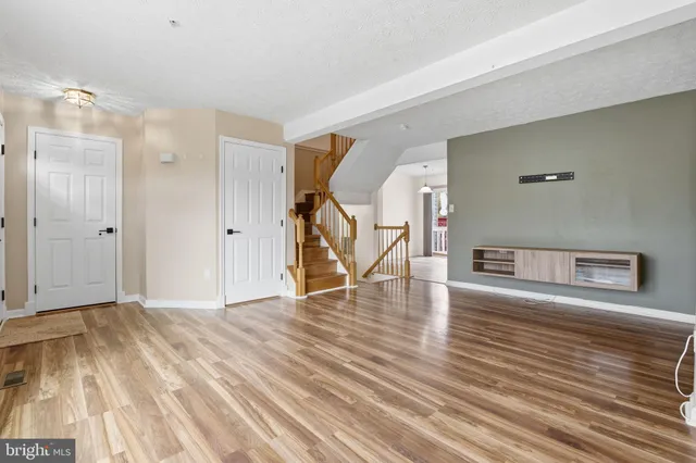 a view of a livingroom with wooden floor