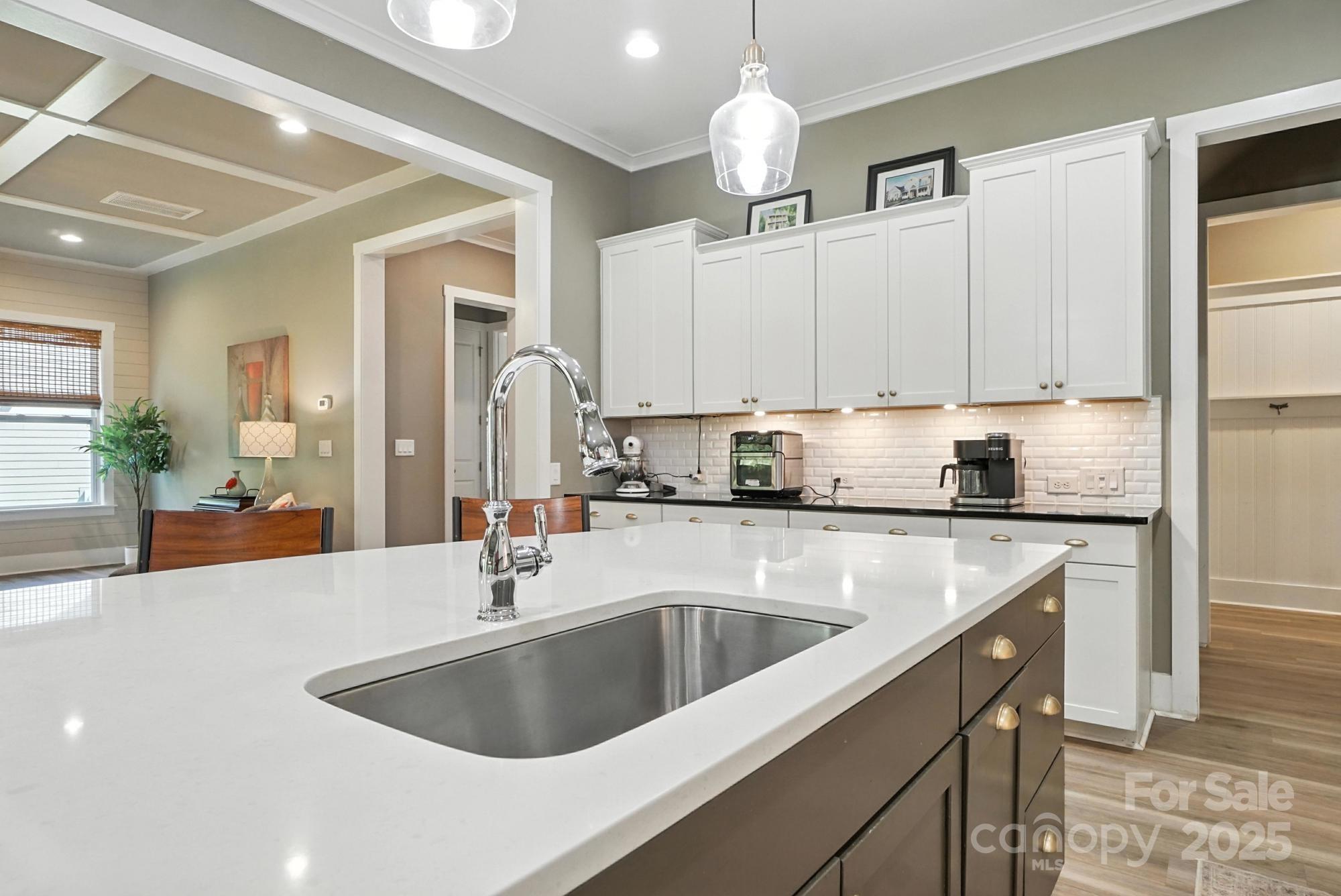 1908 Masons Bend Drive Fort Mill, SC 29708 - Photo 13 of 45 a kitchen with stainless steel appliances a sink a stove and cabinets