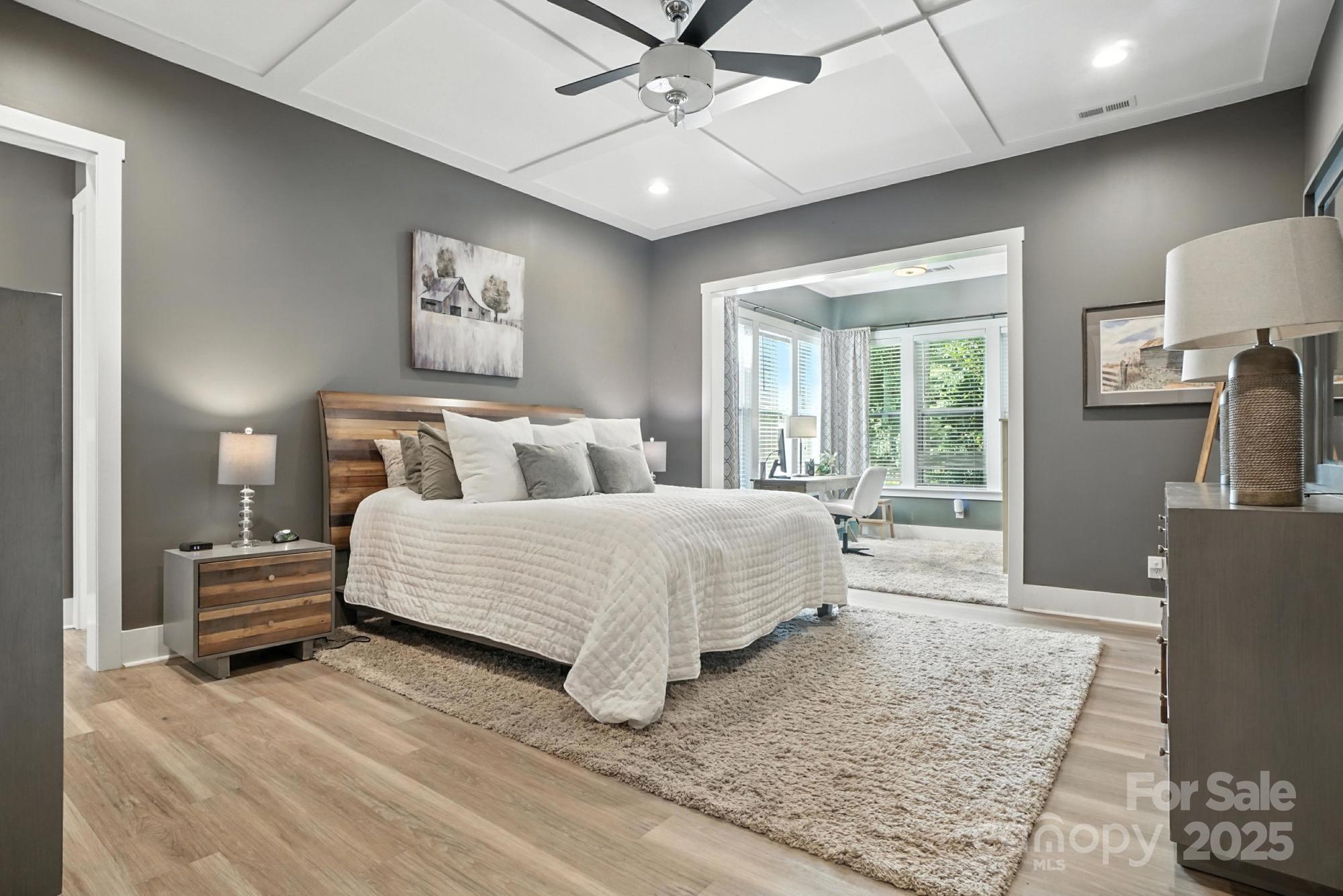 1908 Masons Bend Drive Fort Mill, SC 29708 - Photo 19 of 45 a bedroom with a large bed and a chandelier