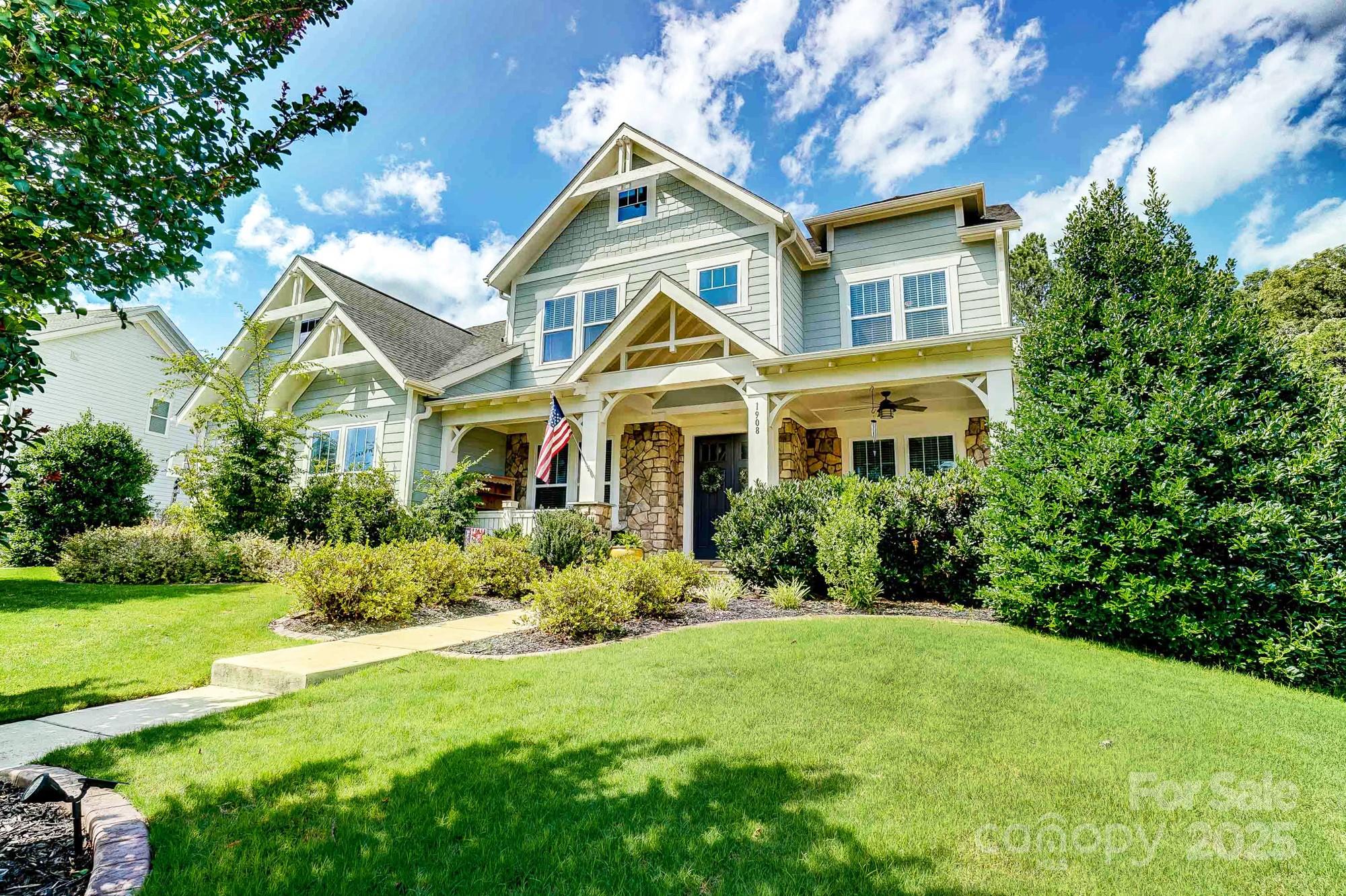 1908 Masons Bend Drive Fort Mill, SC 29708 - Photo 2 of 45 a front view of a house with a yard and potted plants