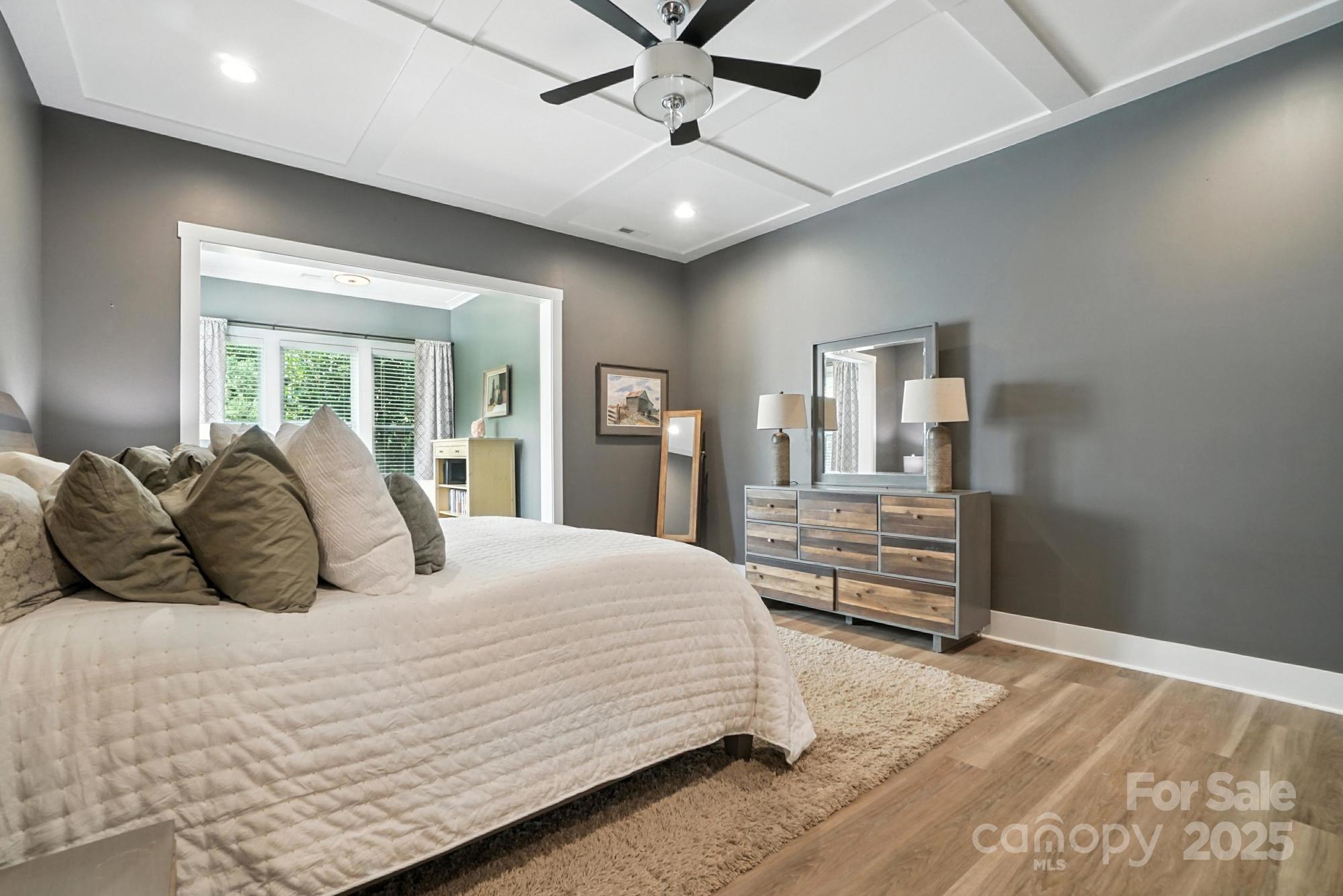 1908 Masons Bend Drive Fort Mill, SC 29708 - Photo 21 of 45 a bedroom with a large bed and a chandelier