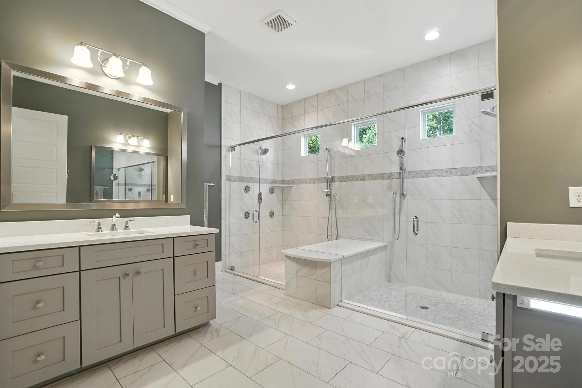 1908 Masons Bend Drive Fort Mill, SC 29708 - Photo 22 of 45 a bathroom with a shower a sink and a mirror