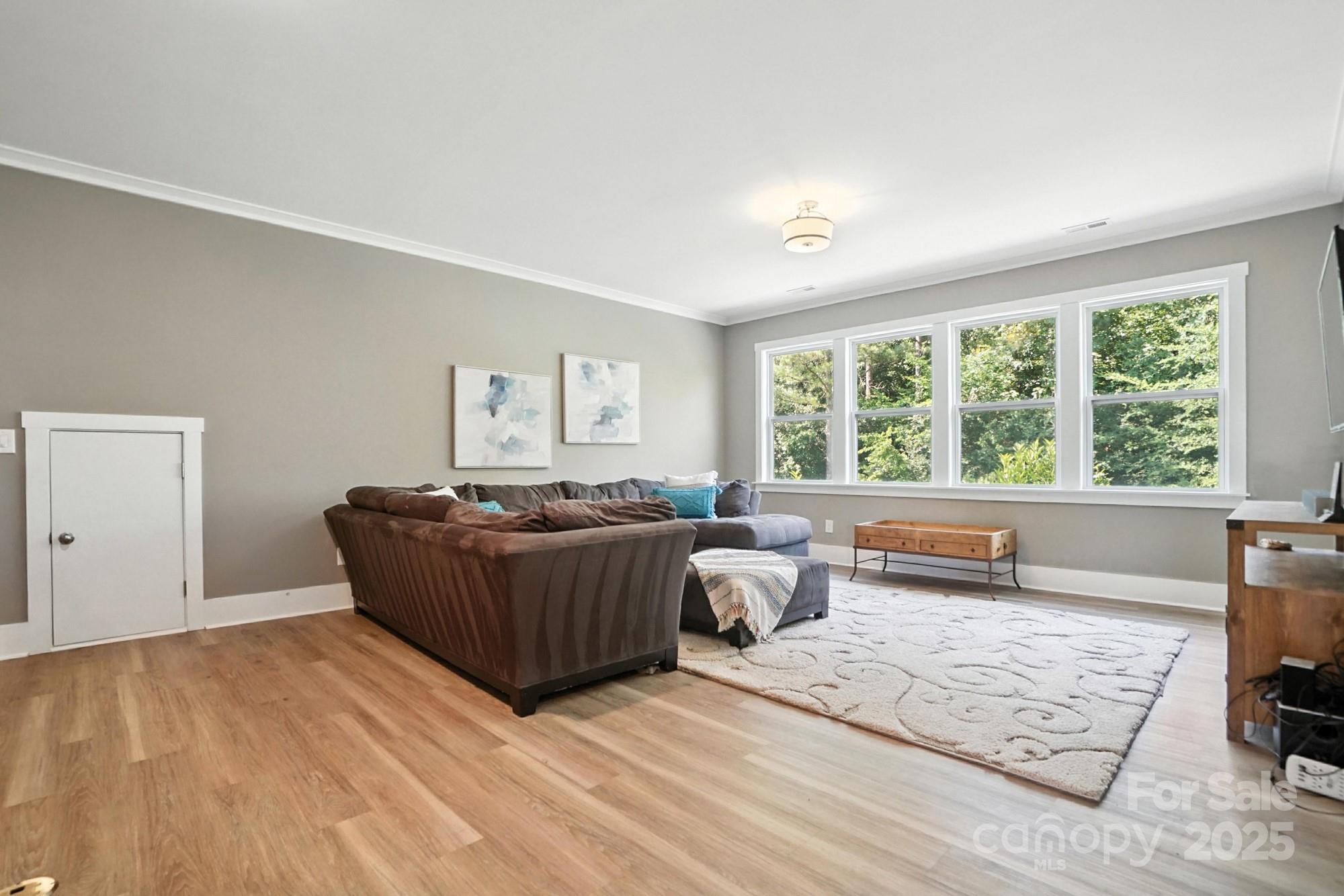 1908 Masons Bend Drive Fort Mill, SC 29708 - Photo 27 of 45 a living room with furniture and a large window