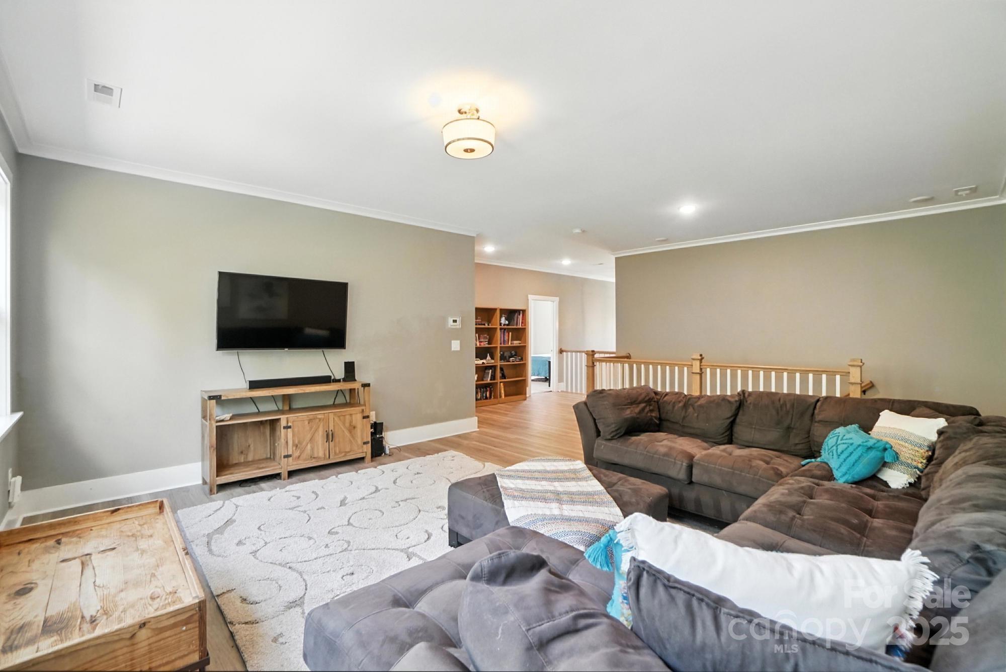 1908 Masons Bend Drive Fort Mill, SC 29708 - Photo 28 of 45 a living room with furniture and a flat screen tv