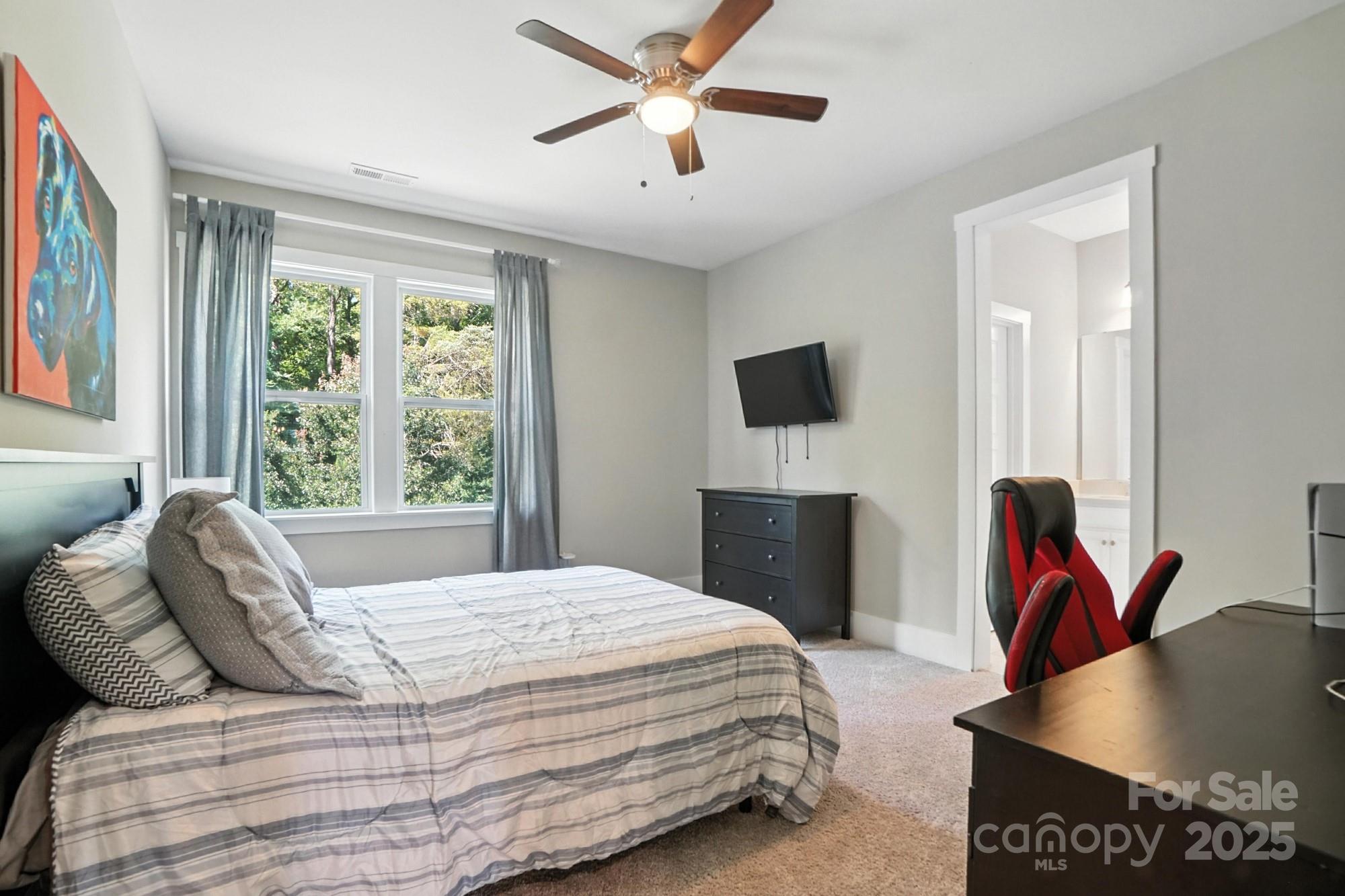 1908 Masons Bend Drive Fort Mill, SC 29708 - Photo 29 of 45 a bedroom with a bed and a flat screen tv