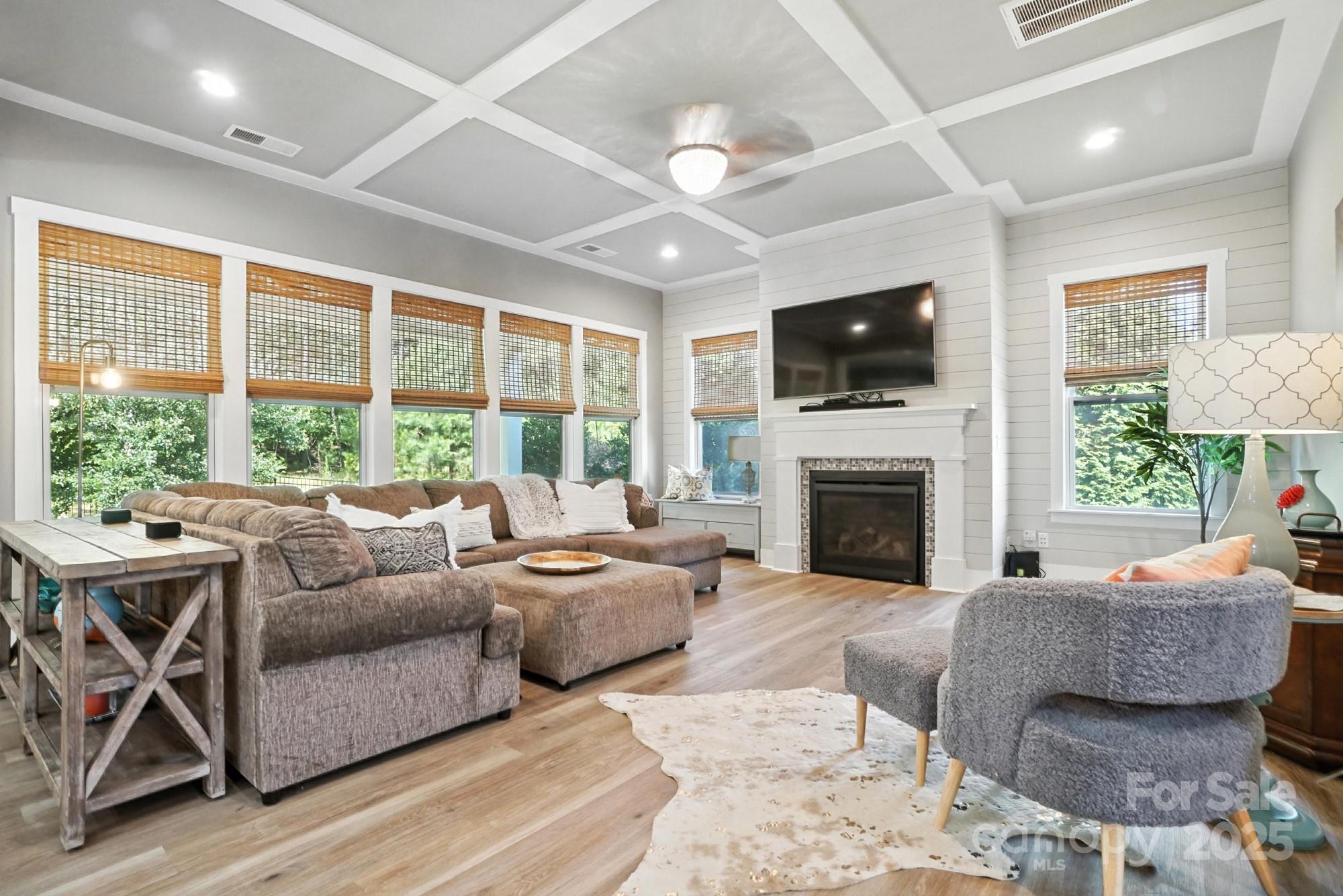 1908 Masons Bend Drive Fort Mill, SC 29708 - Photo 7 of 45 a living room with furniture a flat screen tv and a fireplace
