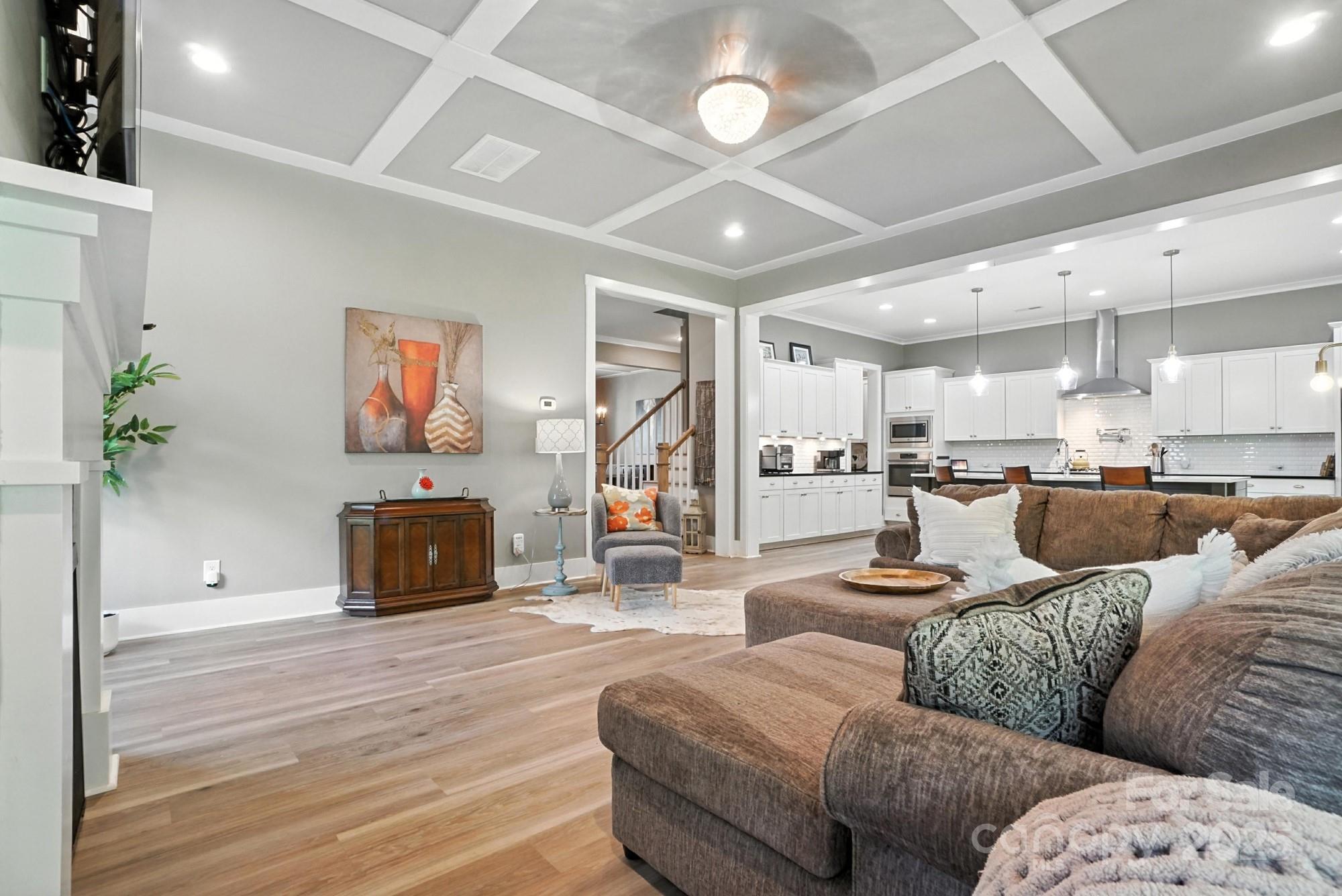 1908 Masons Bend Drive Fort Mill, SC 29708 - Photo 8 of 45 a living room with furniture kitchen view and a fireplace