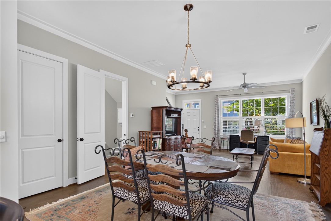 112 Tuttle Street Clemson, SC 29631 - Photo 14 of 46 Hardwood floors and bright windows illuminate a versatile living and dining area.