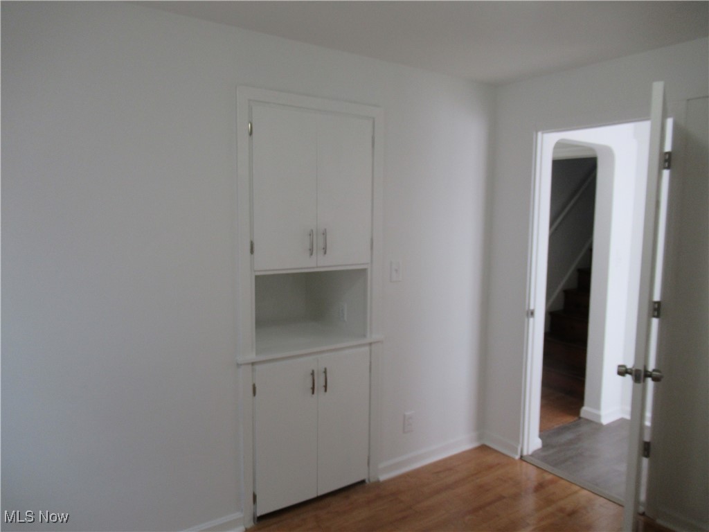 1397 Sunset Road Cleveland, OH 44124 - Photo 15 of 32 Empty room with wood finished floors and baseboards