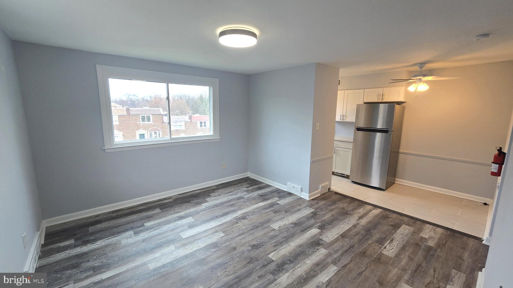 5099 Palmers Mill Road, Unit 2 Clifton Heights, PA 19018 - Photo 3 of 11 a view of empty room with wooden floor and fan