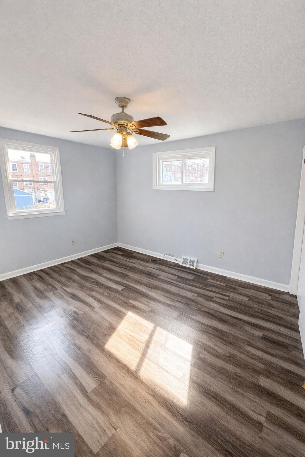 5099 Palmers Mill Road, Unit 2 Clifton Heights, PA 19018 - Photo 9 of 11 a view of empty room with wooden floor and fan