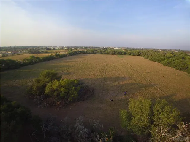 a view of a lake in middle of forest