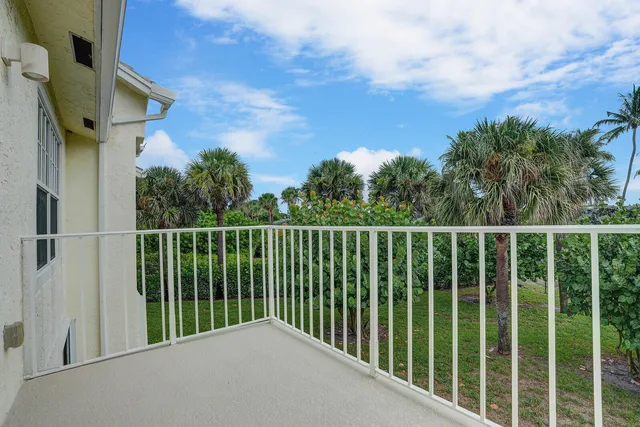 a balcony with a yard