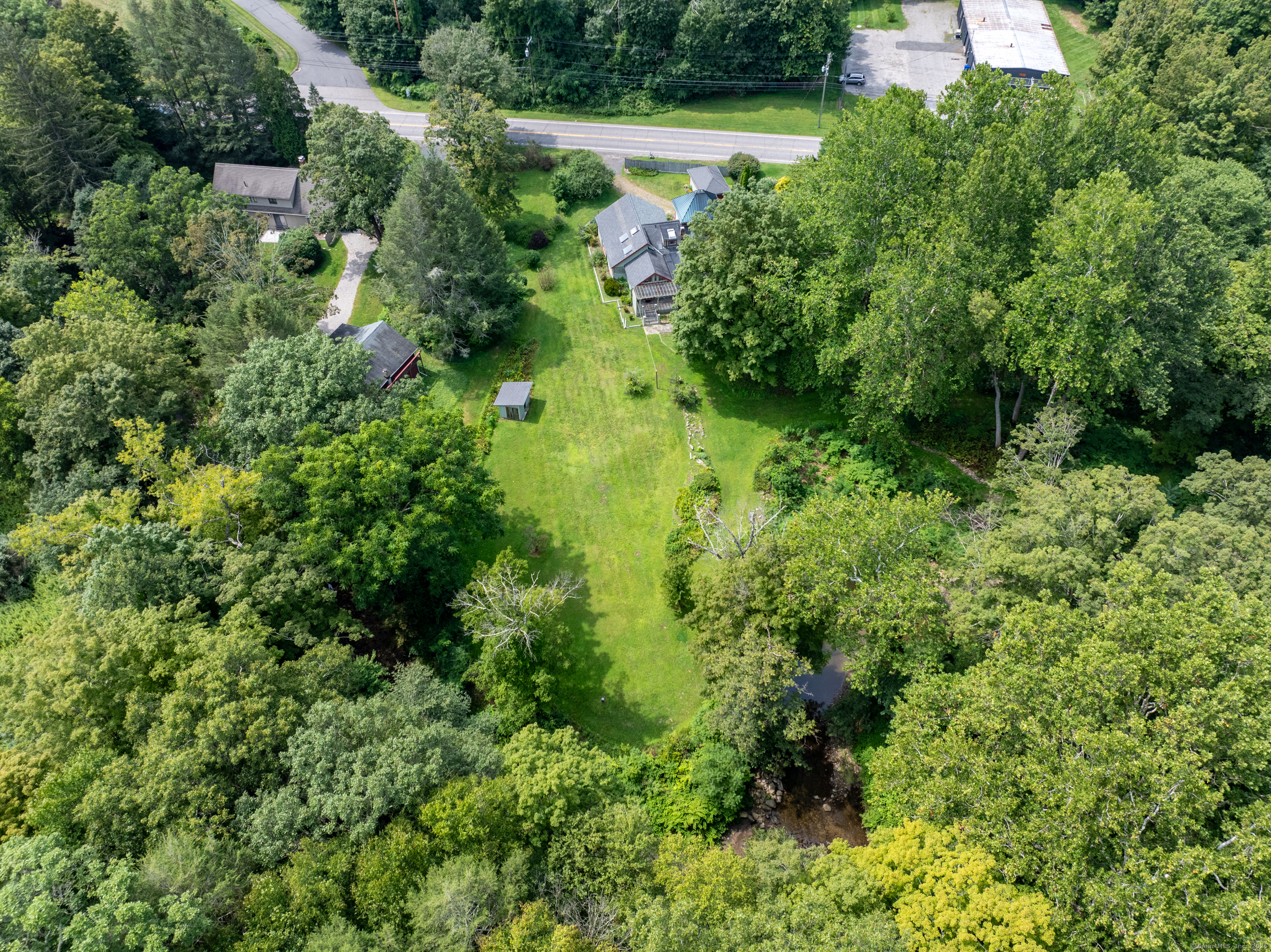 326 Litchfield Road New Milford, CT 06776 - Photo 2 of 40 an aerial view of residential house with outdoor space and trees all around