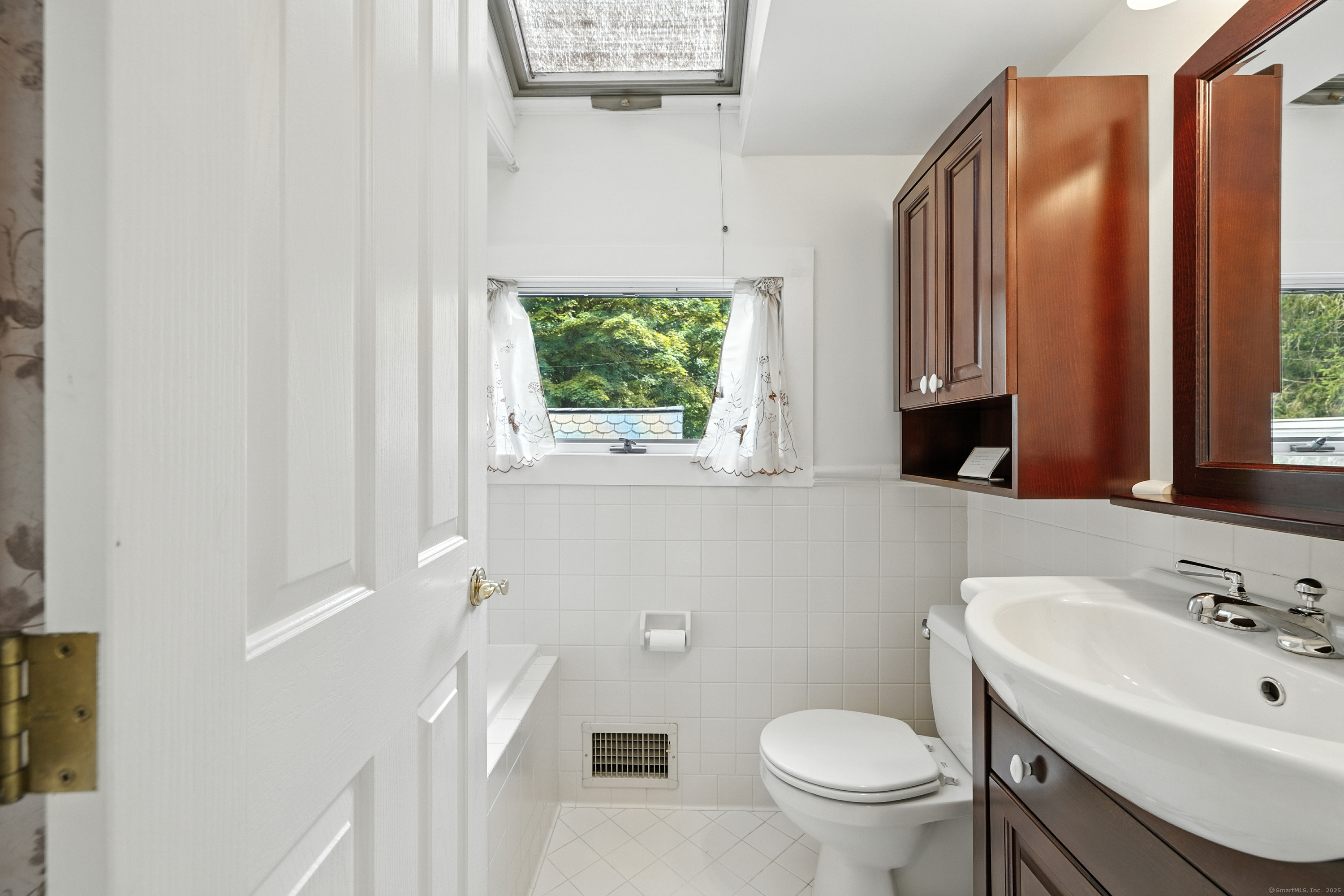 326 Litchfield Road New Milford, CT 06776 - Photo 29 of 40 a bathroom with a sink a toilet and a mirror