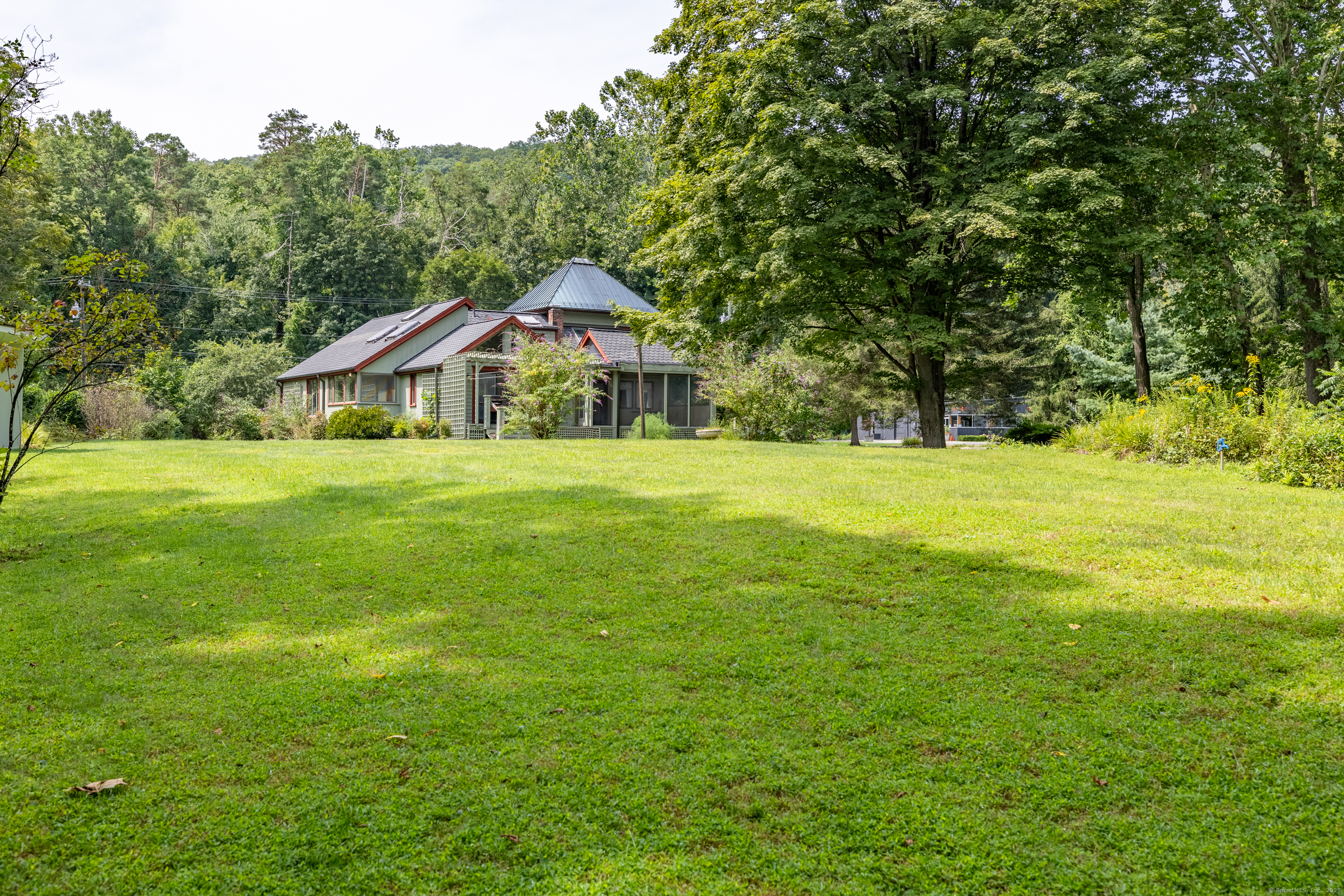 326 Litchfield Road New Milford, CT 06776 - Photo 35 of 40 a front view of a house with a yard