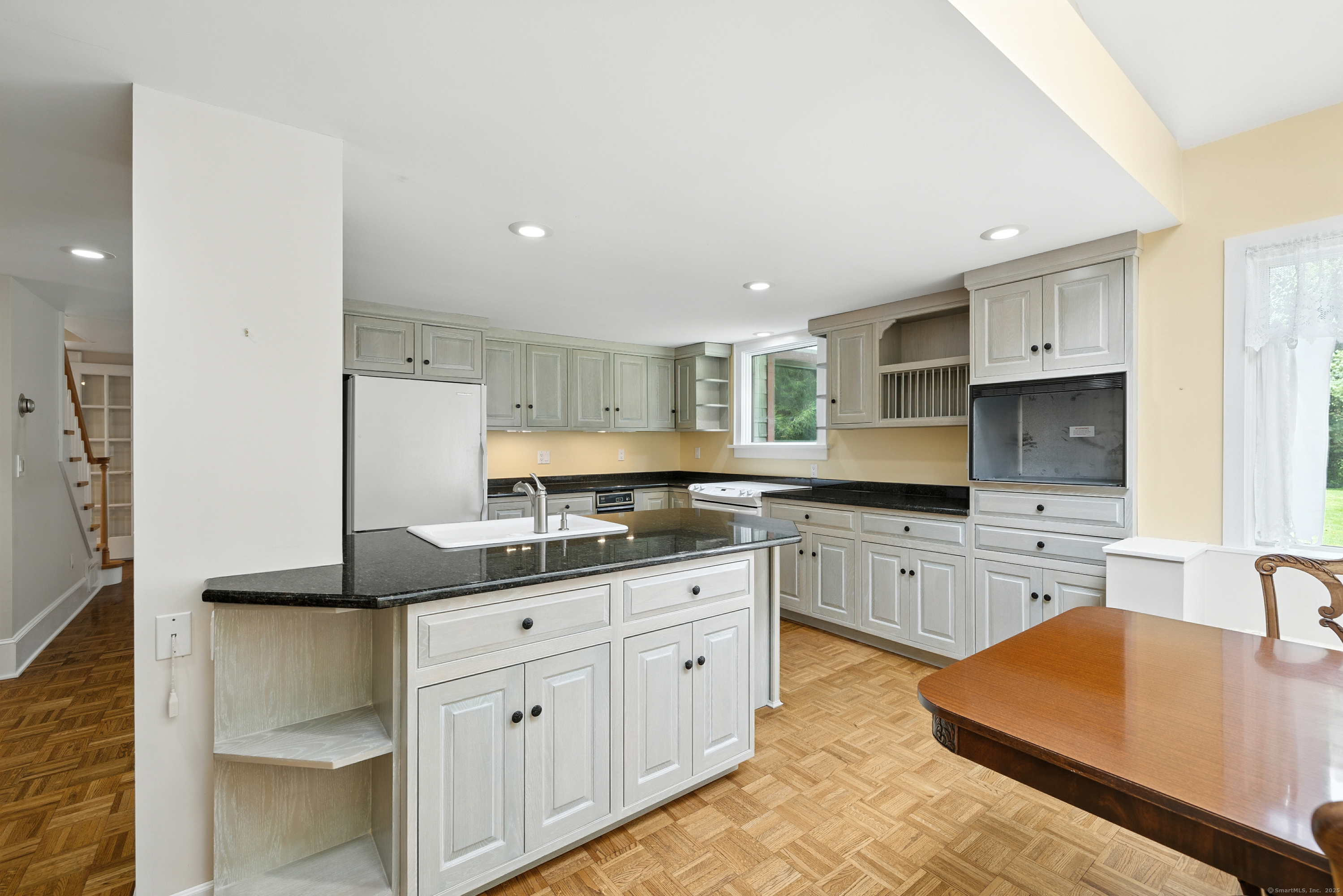 326 Litchfield Road New Milford, CT 06776 - Photo 6 of 40 a kitchen with a sink stove and refrigerator