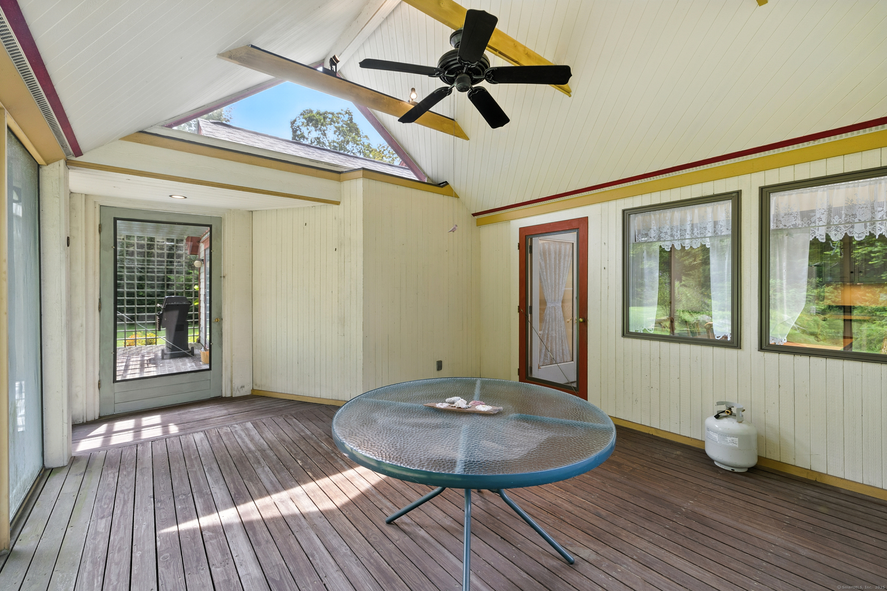 326 Litchfield Road New Milford, CT 06776 - Photo 8 of 40 a view of a room with wooden floor and furniture