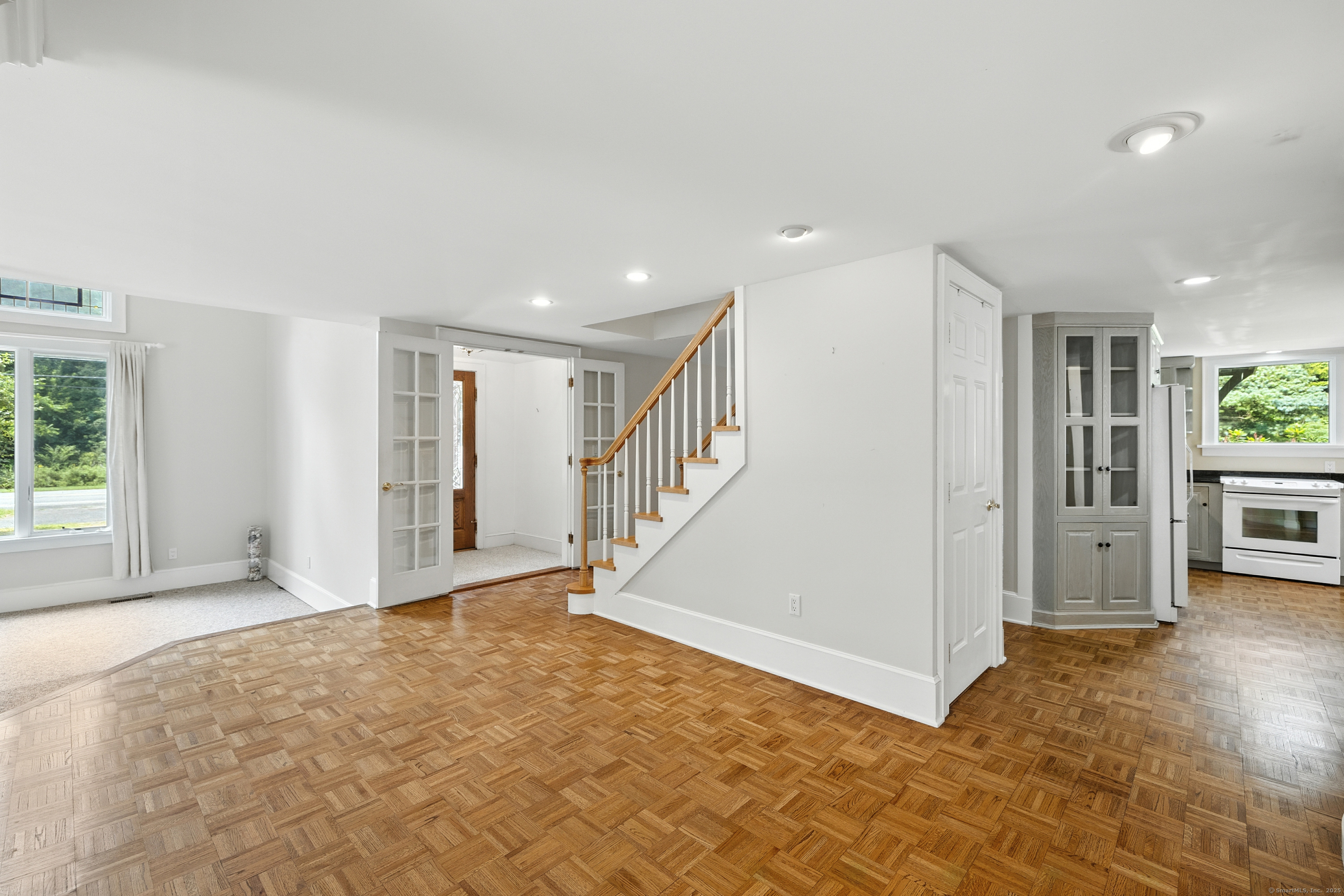 326 Litchfield Road New Milford, CT 06776 - Photo 10 of 40 a view of an empty room with wooden floor and a window