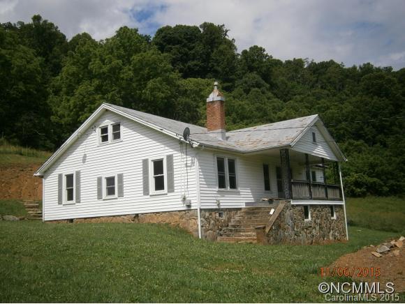 600 Wilson Branch Road Canton, NC 28716 - Photo 1 of 24 a front view of a house with a garden