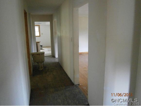 600 Wilson Branch Road Canton, NC 28716 - Photo 23 of 24 a view of a hallway with a chair and a door