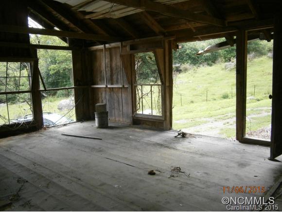 600 Wilson Branch Road Canton, NC 28716 - Photo 8 of 24 a view of an empty room with a sliding door