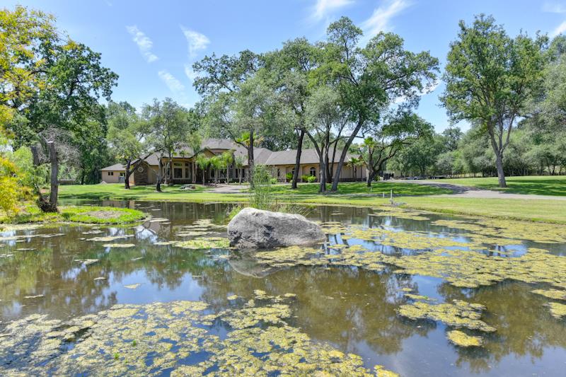 3164 Humphrey Road Loomis, CA 95650 - Photo 4 of 33 a view of a lake with a large trees