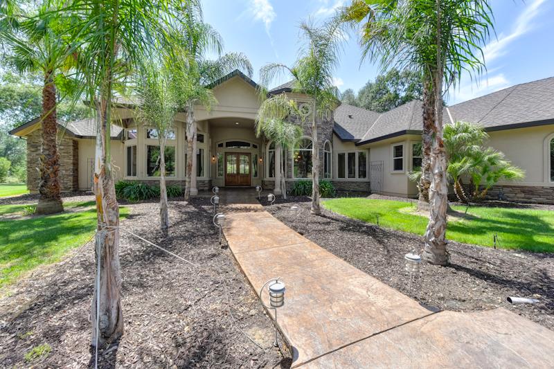 3164 Humphrey Road Loomis, CA 95650 - Photo 6 of 33 a view of a house with a yard and palm trees