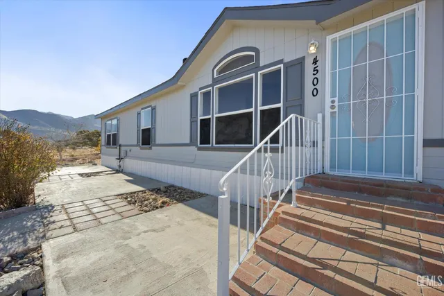 a view of house with wooden floor and a ocean view