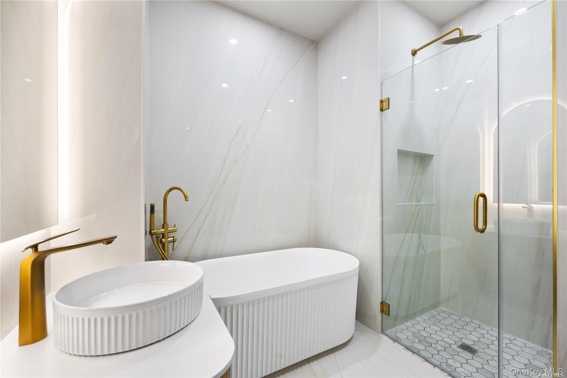 31-16 21st Street, Unit 3A Queens, NY 11106 - Photo 9 of 14 a bathroom with a sink a toilet and shower