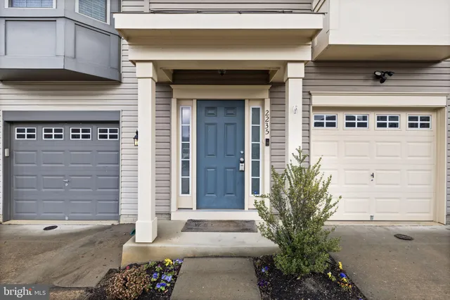 a front view of a house with a garage