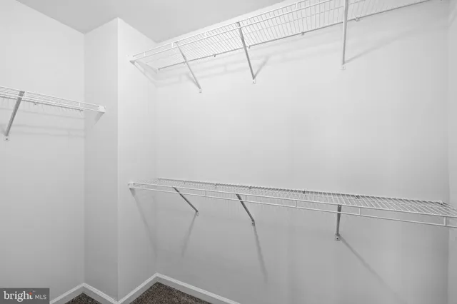 a bathroom with a double vanity sink mirror and toilet