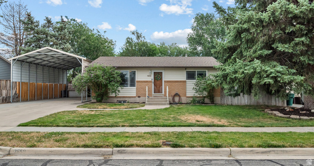 7659 State Street Midvale, UT 84047 - Photo 1 of 33 Single-story residence featuring light-colored siding and brick accents