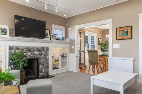 a view of a patio with a table and chairs under an umbrella