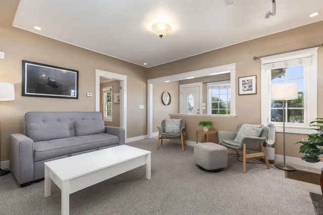 a bedroom with a bed and a lamp