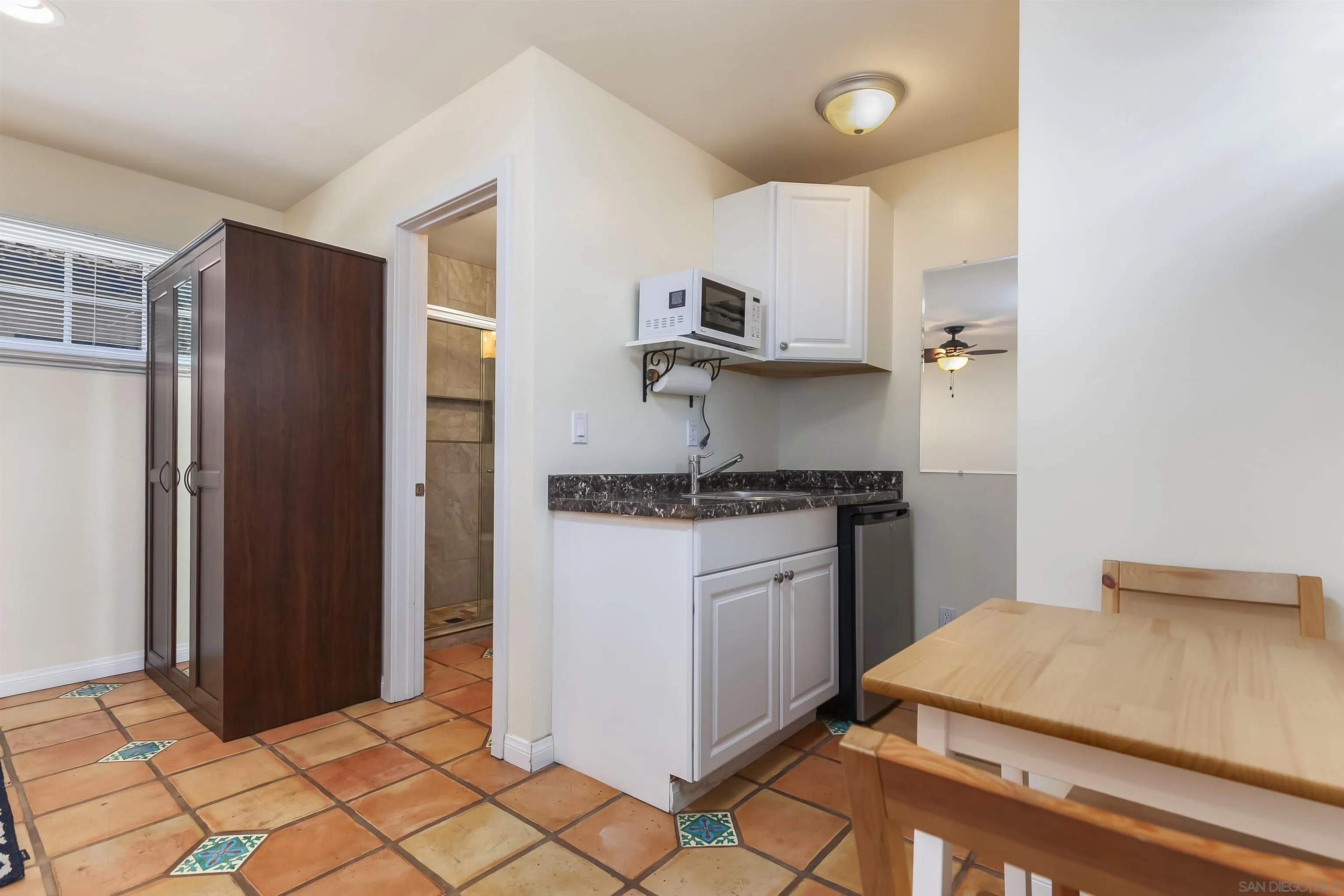 2544 Juan Street San Diego, CA 92110 - Photo 38 of 54 a kitchen with stainless steel appliances granite countertop a refrigerator and a stove