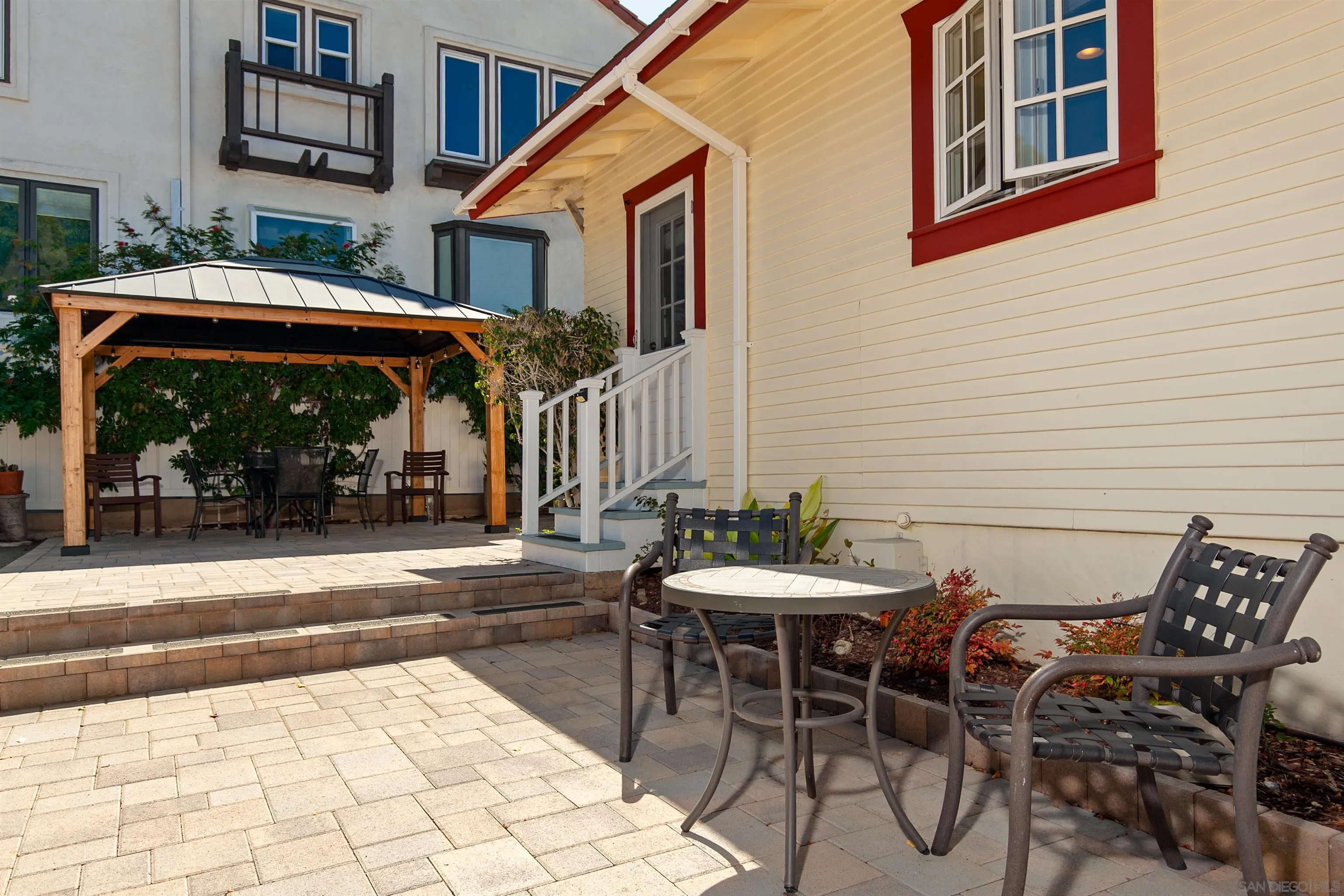 2544 Juan Street San Diego, CA 92110 - Photo 47 of 54 a view of a patio with table and chairs with wooden floor and fence